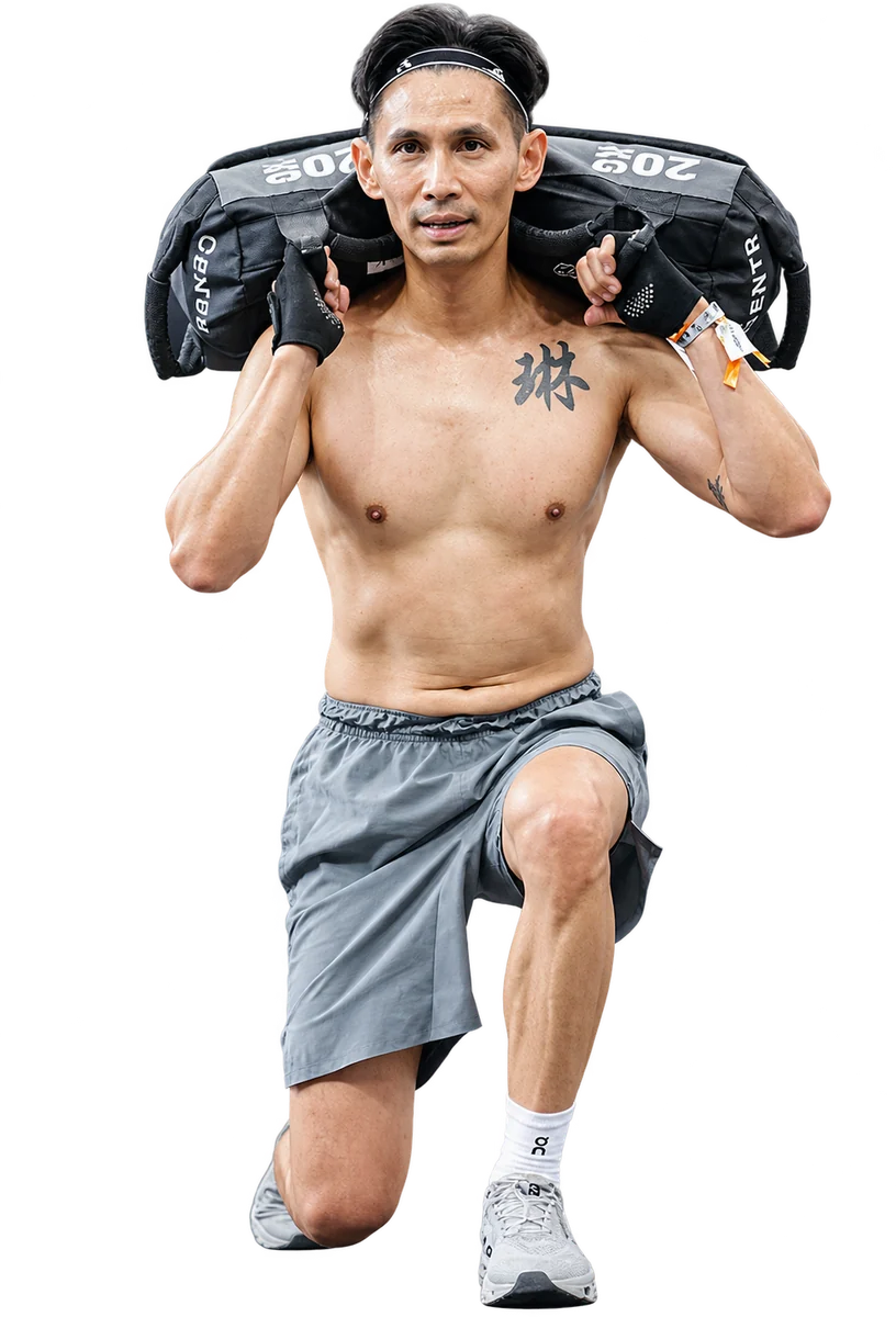 Balance Life founder training with a sandbag